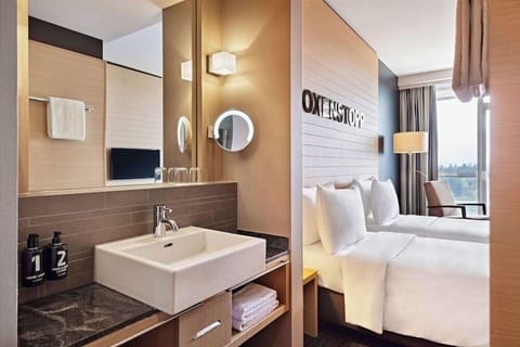 Twin Room | Bathroom | Shower, hair dryer, towels, soap