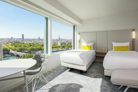 Twin Room with Eiffel Tower View | Premium bedding, in-room safe, desk, blackout drapes