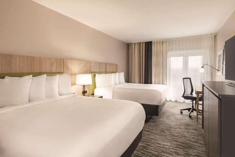 Hypo-allergenic bedding, desk, blackout drapes, soundproofing