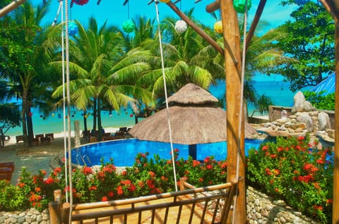 Deluxe Bungalow, Sea View | Minibar, in-room safe, desk, blackout drapes