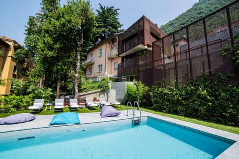 Seasonal outdoor pool, open 9:00 AM to 7:00 PM, pool umbrellas