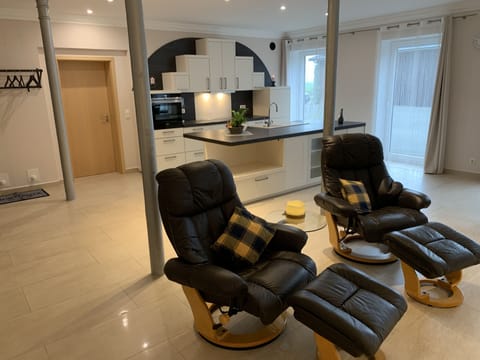 Comfort Suite, 2 Queen Beds, Non Smoking, Courtyard View | Living area | 55-inch flat-screen TV with satellite channels, TV, iPod dock