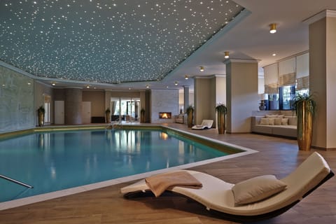 Indoor pool, seasonal outdoor pool, pool umbrellas, sun loungers