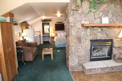 The Love Nest #8 (Indoor 5x5 Jetted Tub,  Gas Fireplace, King Bed | Living area | 34-inch flat-screen TV with cable channels, TV, DVD player