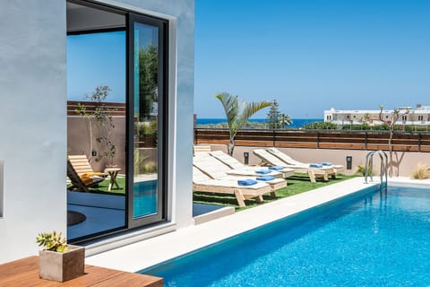 Outdoor pool, a heated pool, open open 24 hours, pool umbrellas