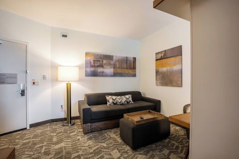 Suite, Multiple Beds | Living area | 37-inch flat-screen TV with cable channels, TV, pay movies