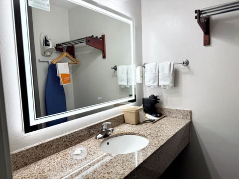 Bathtub, hair dryer, towels, soap