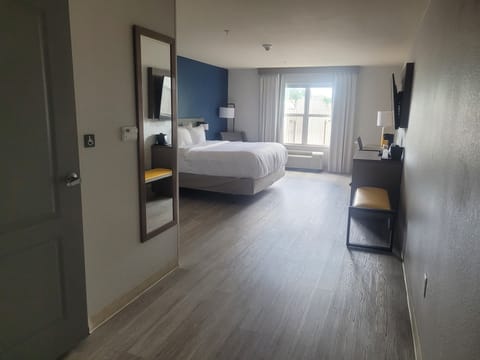 Desk, laptop workspace, blackout drapes, iron/ironing board