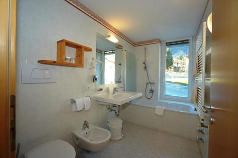 Deep soaking tub, rainfall showerhead, hair dryer, bidet