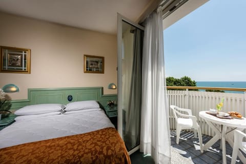 Classic Double or Twin Room, Balcony, Partial Sea View | Minibar, in-room safe, soundproofing, bed sheets