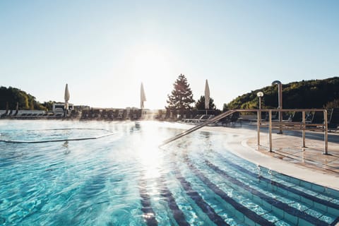 5 indoor pools, 11 outdoor pools, open 7 AM to 9 PM, pool umbrellas
