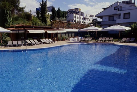 Outdoor pool, open 10:00 AM to 7:00 PM, pool umbrellas, sun loungers