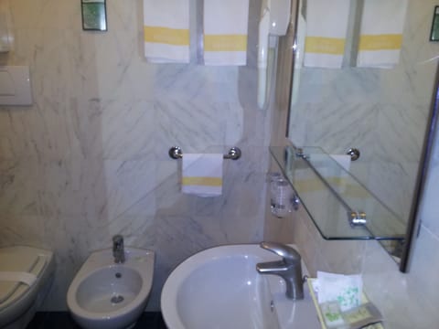 Shower, free toiletries, hair dryer, slippers