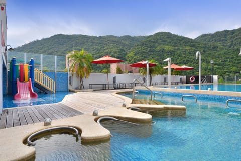 Outdoor pool, open 1:00 PM to 9:30 PM, pool umbrellas, sun loungers