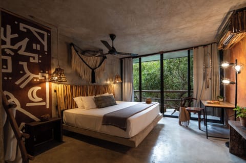 Deluxe room with one king bed | In-room safe, blackout drapes, WiFi (free), individually decorated
