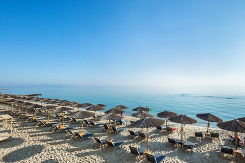 On the beach, sun loungers, beach umbrellas, beach towels