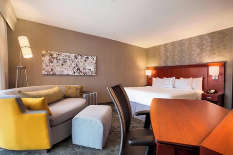 Premium bedding, desk, laptop workspace, iron/ironing board