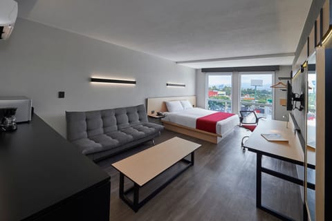 Suite, 1 King Bed with Sofa bed | Desk, blackout drapes, iron/ironing board, free cribs/infant beds