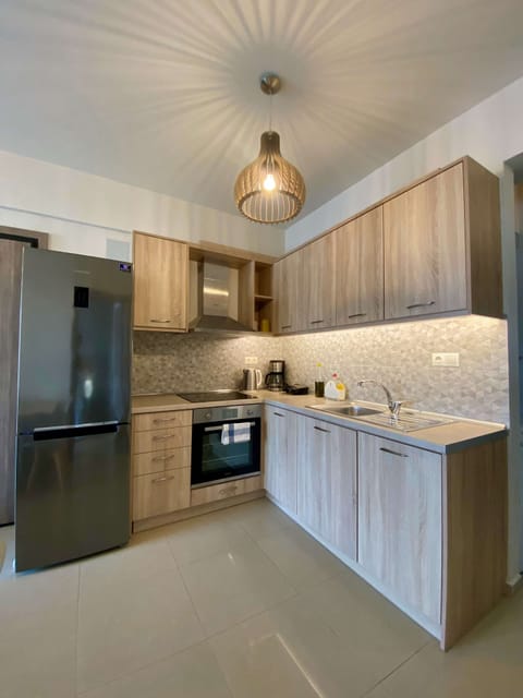 Luxury Apartment, 2 Bedrooms | Private kitchen | Full-size fridge, oven, stovetop, coffee/tea maker