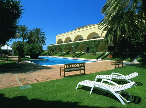 Outdoor pool, open noon to 8:00 PM, pool umbrellas, sun loungers