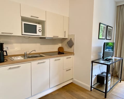 Studio, Patio | Private kitchen