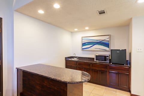 Suite, 1 King Bed, Pool View | Private kitchen | Coffee/tea maker