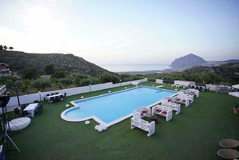 Seasonal outdoor pool, open 8:00 AM to 8:00 PM, pool umbrellas