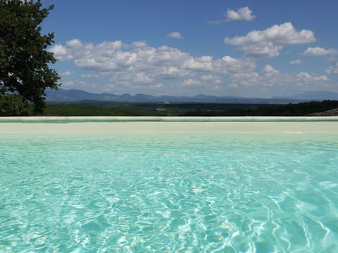 Outdoor pool, a heated pool, sun loungers