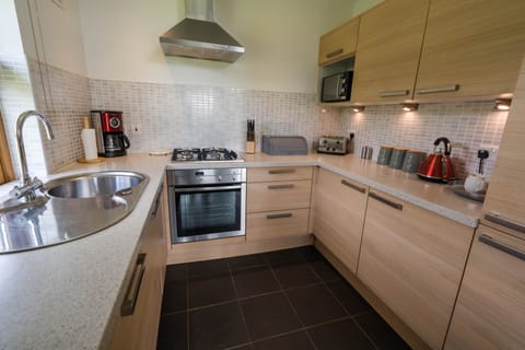 Drummond Chalet - Pets Allowed | Private kitchen | Full-size fridge, microwave, oven, stovetop