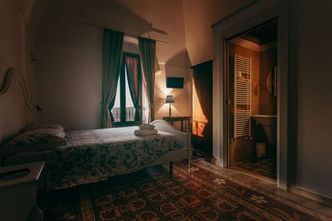 Comfort Quadruple Room, Private Bathroom | Minibar, desk, bed sheets