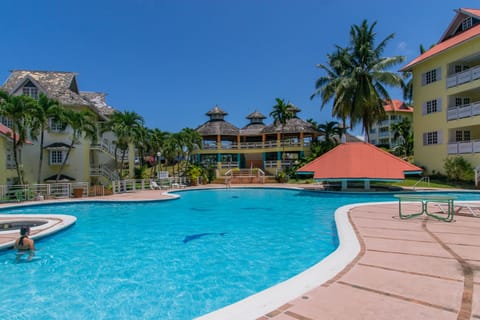 Outdoor pool, open 8:00 AM to 9:00 PM, lifeguards on site