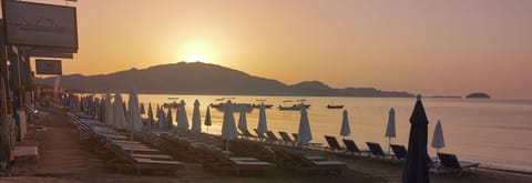 On the beach, sun loungers, beach umbrellas, beach bar