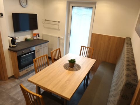 Family Apartment, Multiple Beds | In-room dining