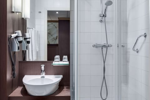 Deep soaking tub, rainfall showerhead, eco-friendly toiletries