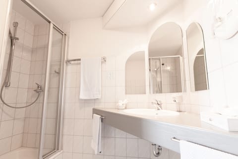 Shower, free toiletries, hair dryer, slippers