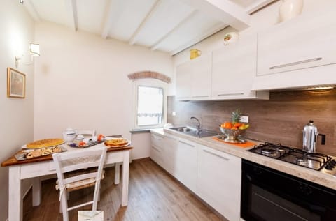 Apartment, 2 Bedrooms (La Piccionaia) | Private kitchen | Full-size fridge, microwave, oven, stovetop