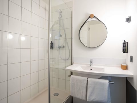 Bathtub, eco-friendly toiletries, hair dryer, towels