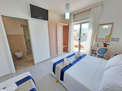 Triple Room, Partial Sea View | In-room safe, desk, free WiFi, bed sheets
