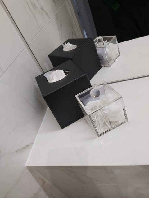 Shower, designer toiletries, hair dryer, towels