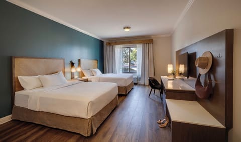 Premium bedding, down comforters, pillowtop beds, in-room safe