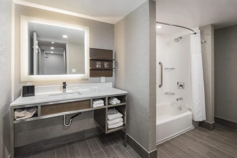 Deluxe Room, 2 Queen Beds, Non Smoking | Bathroom | Combined shower/tub, free toiletries, hair dryer, bathrobes