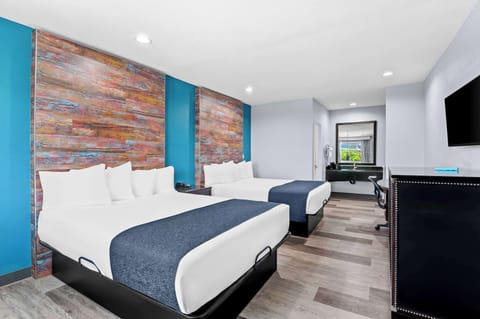 Desk, laptop workspace, blackout drapes, iron/ironing board