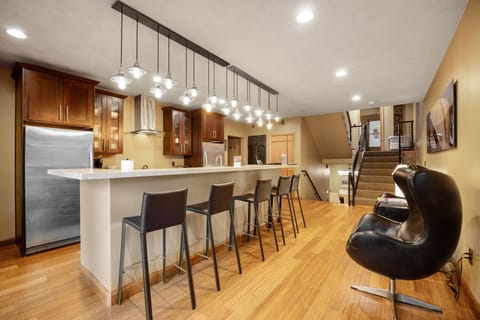 Penthouse Suite | Living area | 40-inch flat-screen TV with cable channels, TV, iPod dock