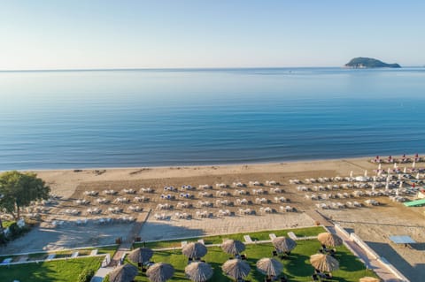 On the beach, sun loungers, beach umbrellas, beach towels