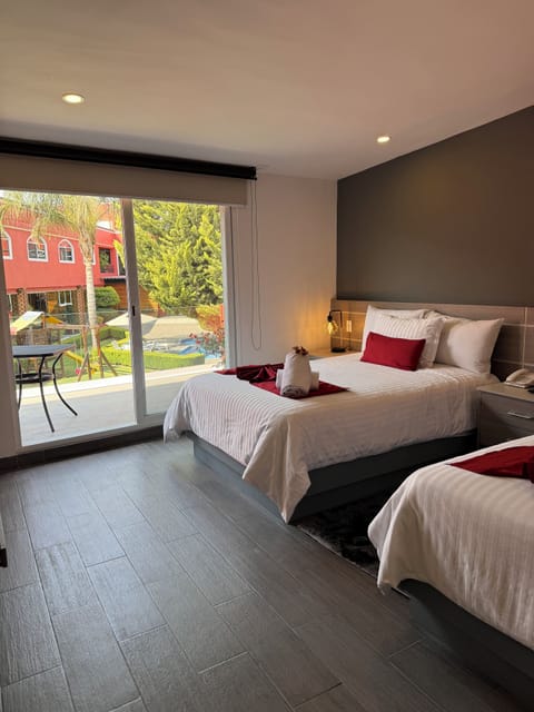 Villa with 2 double beds | Premium bedding, in-room safe, blackout drapes, iron/ironing board