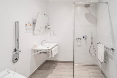 Shower, eco-friendly toiletries, hair dryer, towels