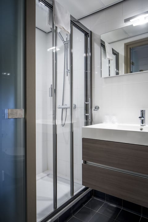 Shower, eco-friendly toiletries, hair dryer, towels