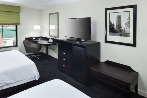 Premium bedding, desk, laptop workspace, blackout drapes