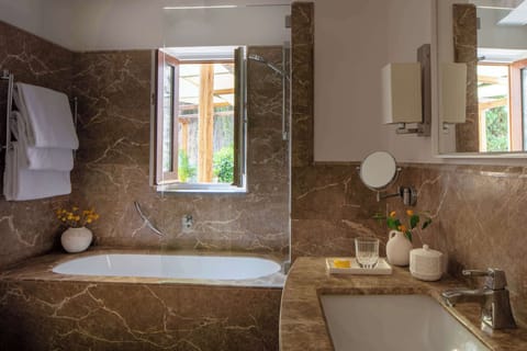 Bathtub, eco-friendly toiletries, hair dryer, bidet