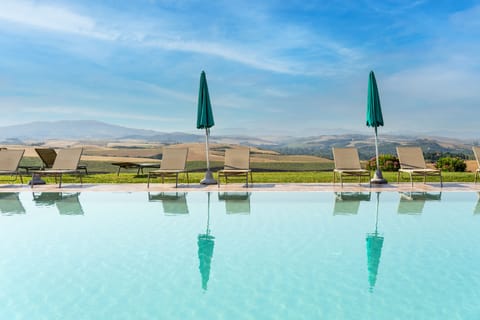 Seasonal outdoor pool, pool umbrellas, sun loungers